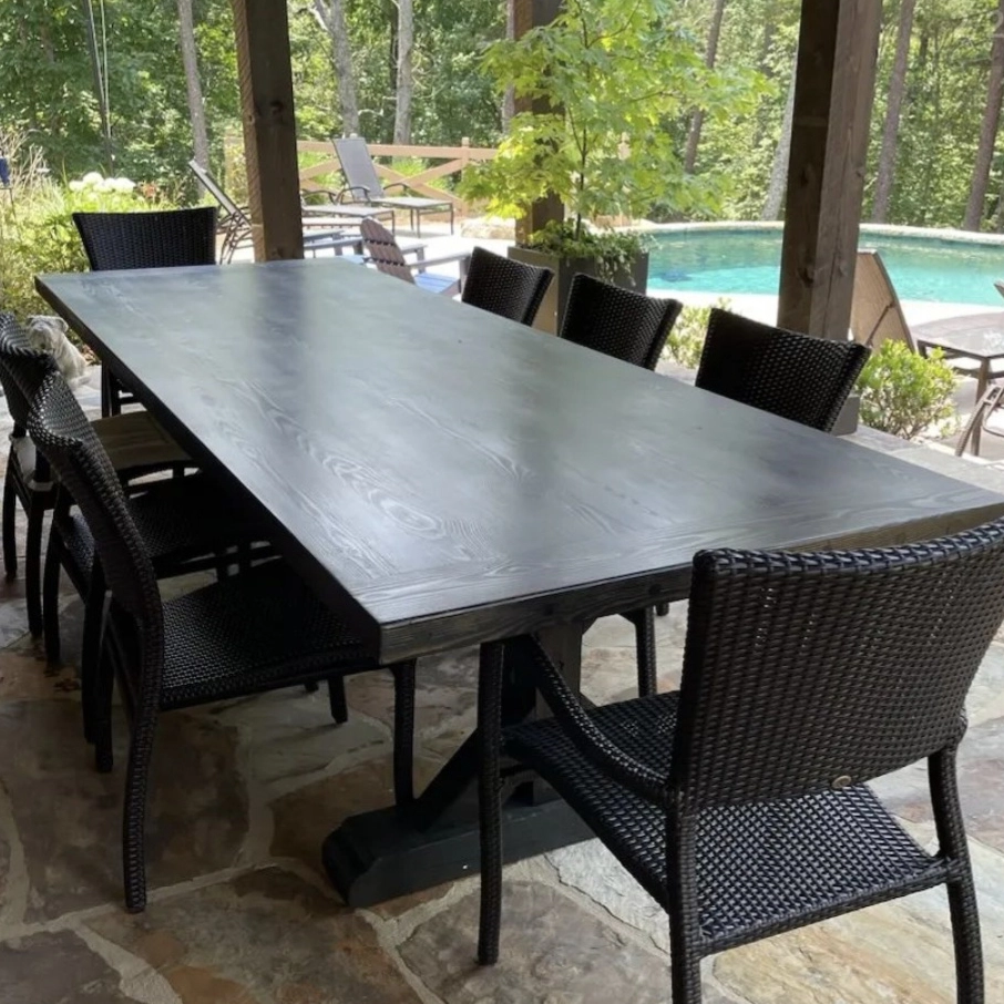 Outdoor black table made of wood on a porch