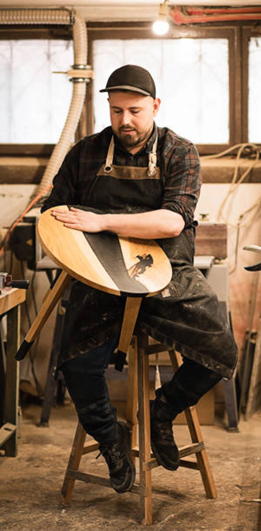 Harvest Custom carpenter putting a hand-crafted wood and resin night stand together