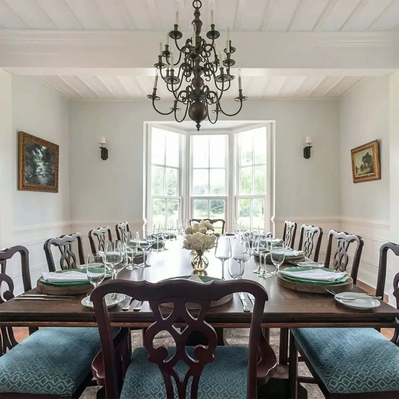 hand-crafted wood dining table with ornate chairs