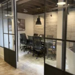 corporate office with black metal sliding barn doors