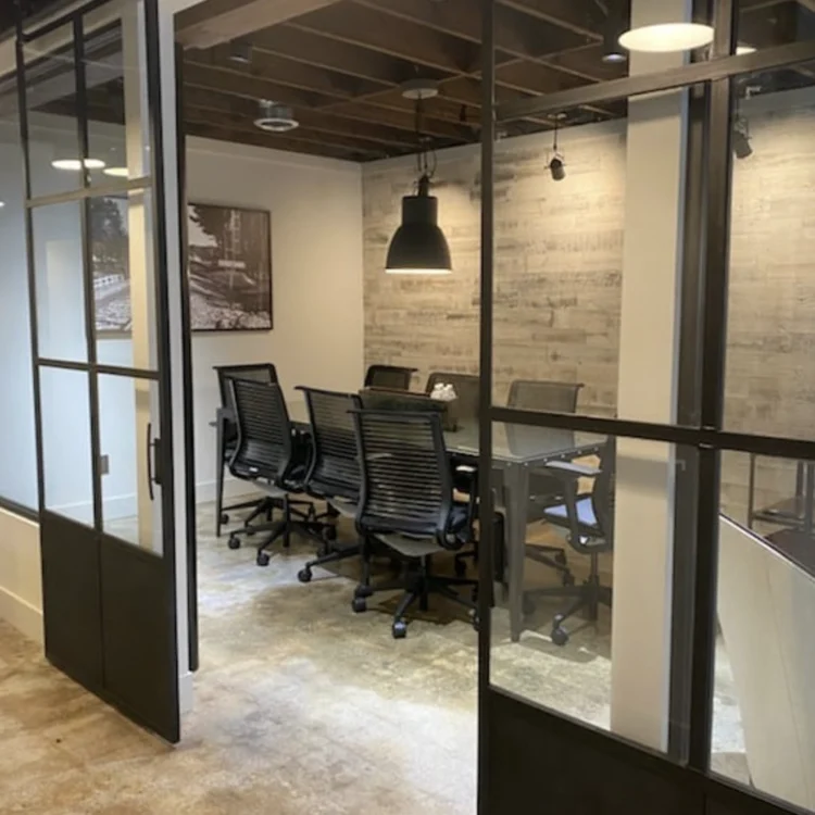 corporate office with black metal sliding barn doors