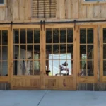 Exterior wooden sliding barn doors with glass