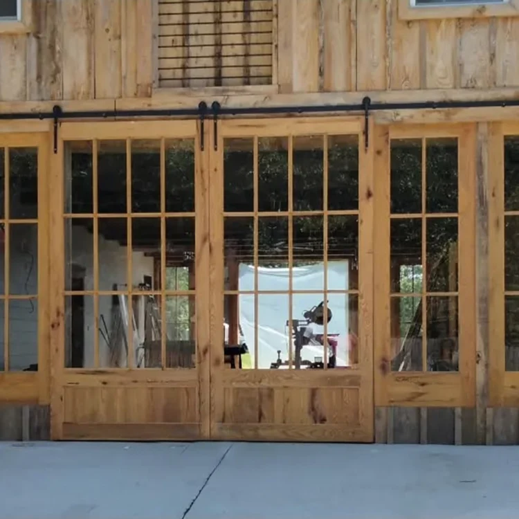 Exterior wooden sliding barn doors with glass