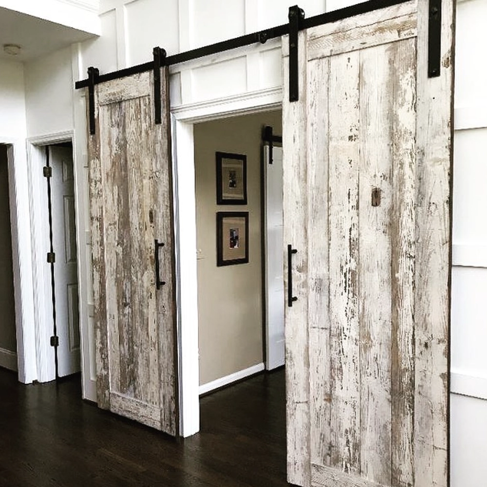 Whitewashed sliding barn door in luxury home