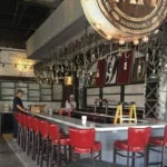 metal bar with red chairs in local restaurant