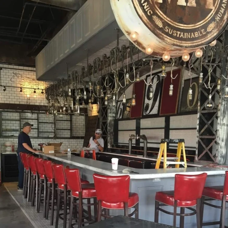 metal bar with red chairs in local restaurant