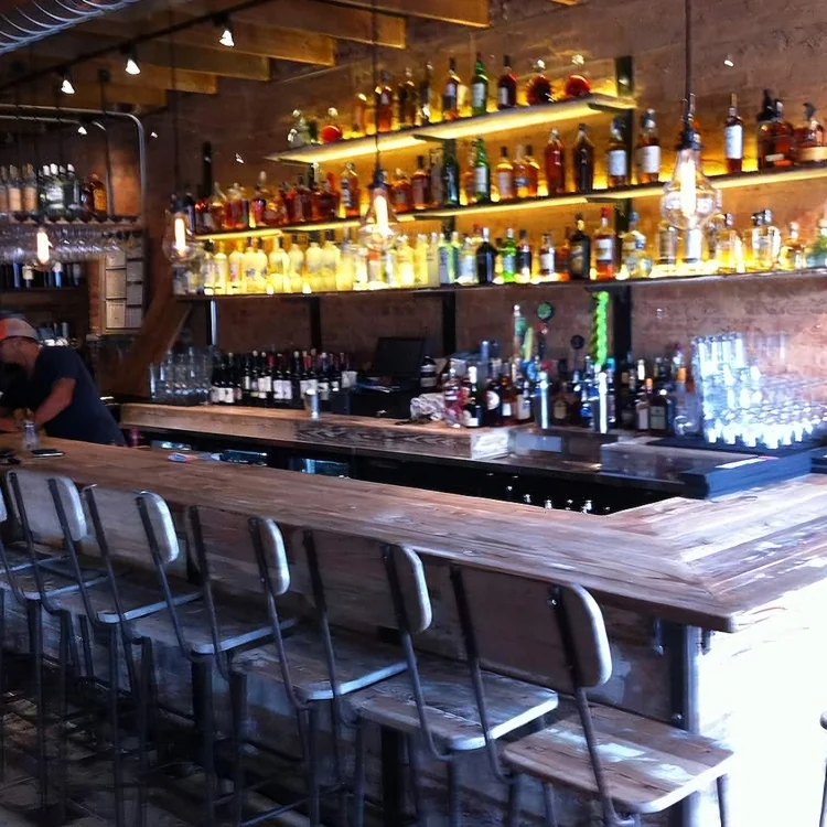 Custom wood bar with handmade chairs