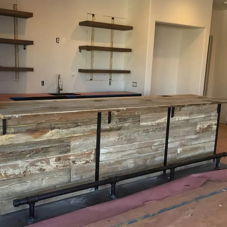 Wood counter and bar in basement with metal foot rest