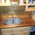 Rustic wood vanity with galvanized steel sink