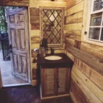 rustic vanity and sink in log cabin