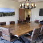 wood top conference table with leather chairs