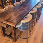 long wooden dining table with custom chairs