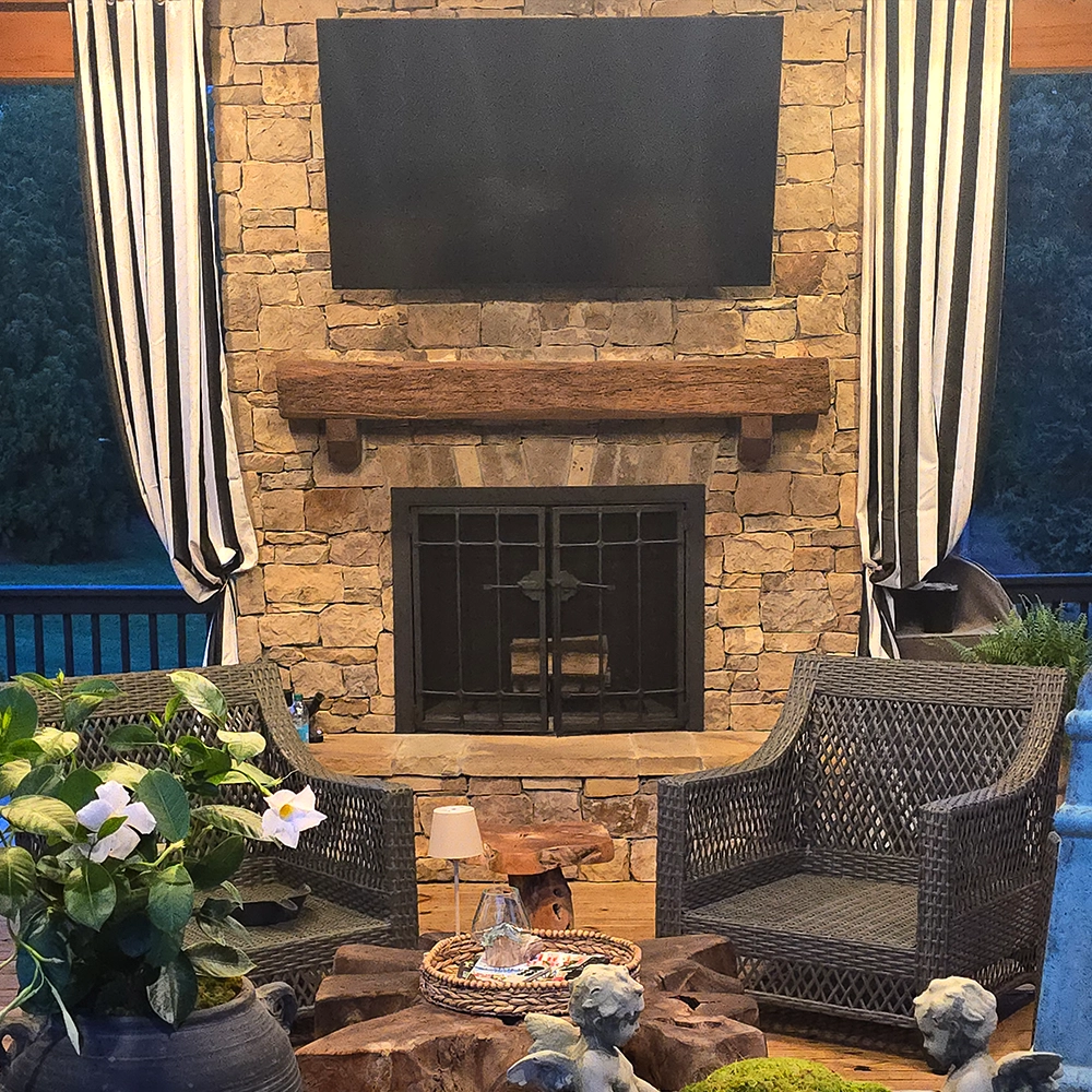 fireplace with reclaimed wood mantle and custom screen