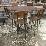 high top chairs and round table made of wood and metal