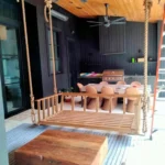 outdoor entertainment area with swing and kitchen