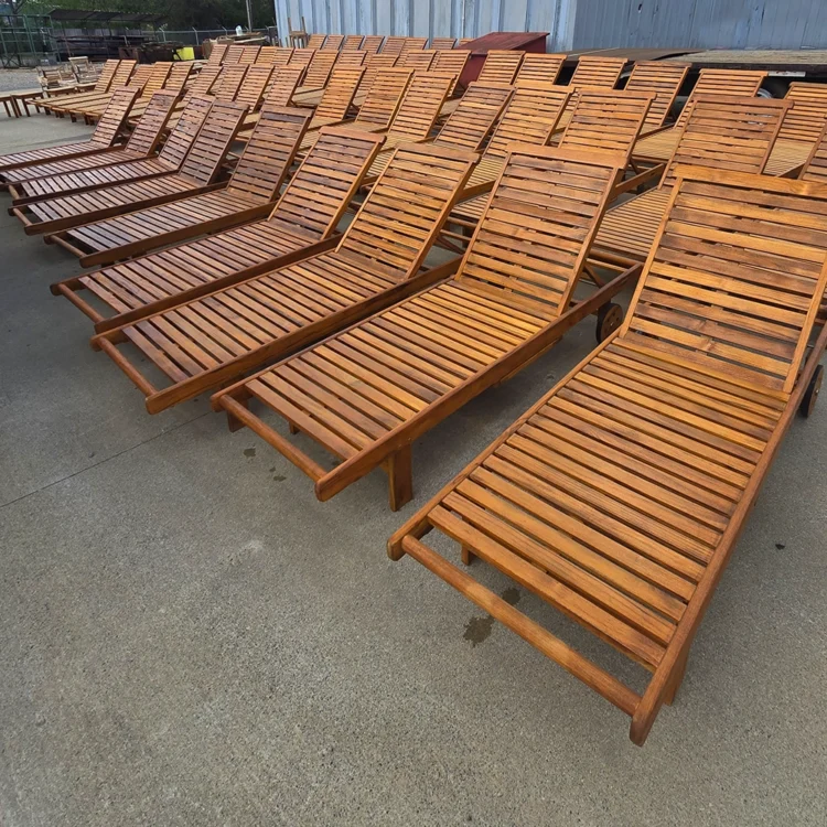 Rows of teak lawn chairs for an exclusive hotel for outdoor seating
