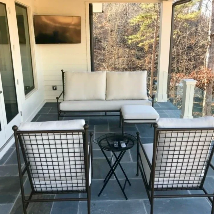 Custom metal frame chairs and sofa made for outdoor seating on porch