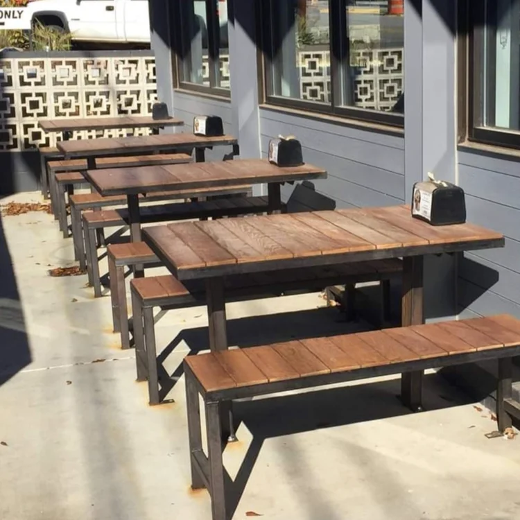 picnic style tables for outdoor seating at a restaurant