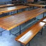 Solid wood bench for outdoor table seating at a restaurant